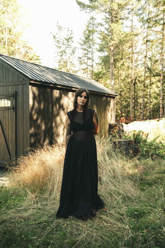 a bridal portrait of a bride in a black wedding dress