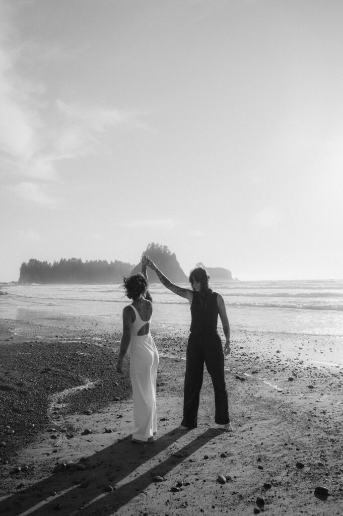 brides twirling on the beach in Olympic national park